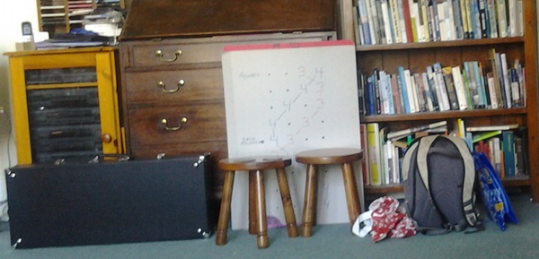 Our sitting room - several sets of handbells and the Handbell Club hunting charts